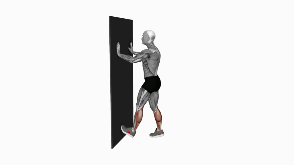 A person doing the Calf Push Stretch against a wall